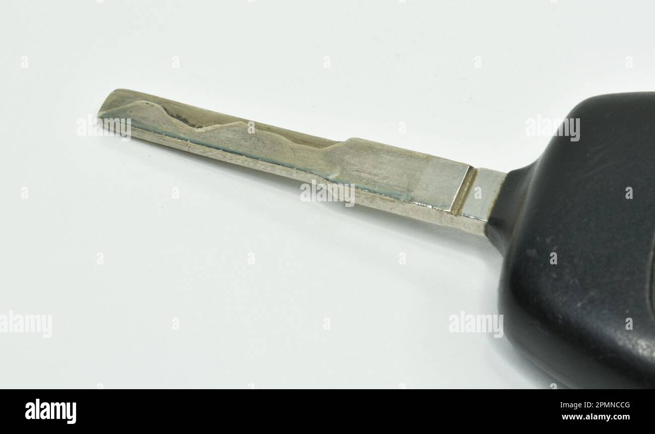 Vintage mechanical car key on white background Stock Photo Alamy
