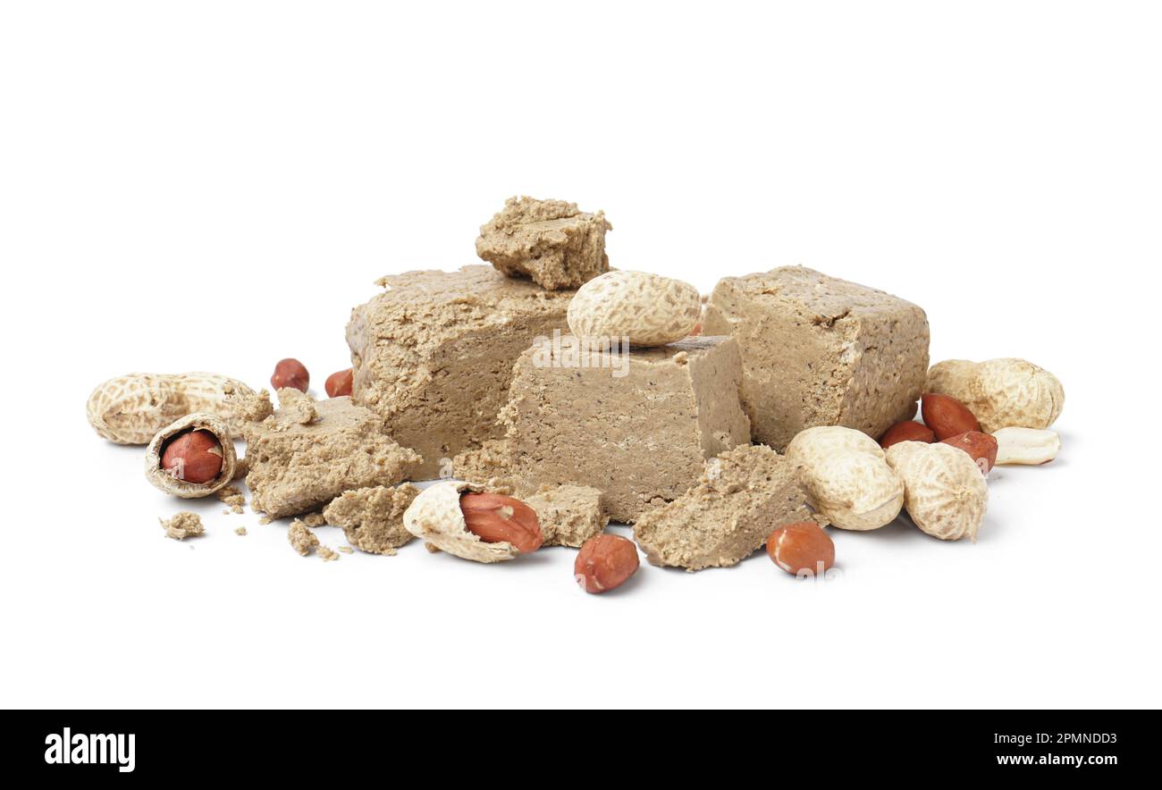 Pieces of sweet halva with peanuts on white background Stock Photo Alamy