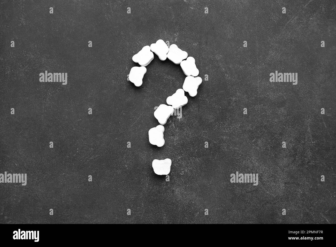 Question mark made of marshmallows on dark background Stock Photo