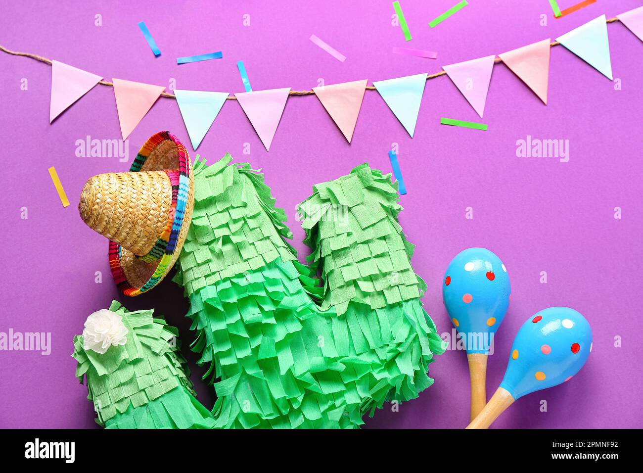 Mexican Paper Flowers and Pinata Stock Photo - Alamy