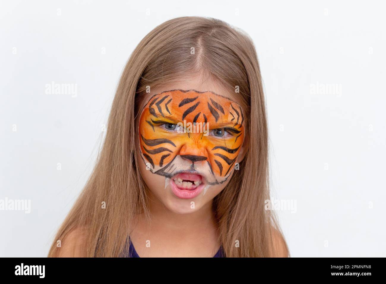 Girl with tiger face painting hi-res stock photography and images - Alamy