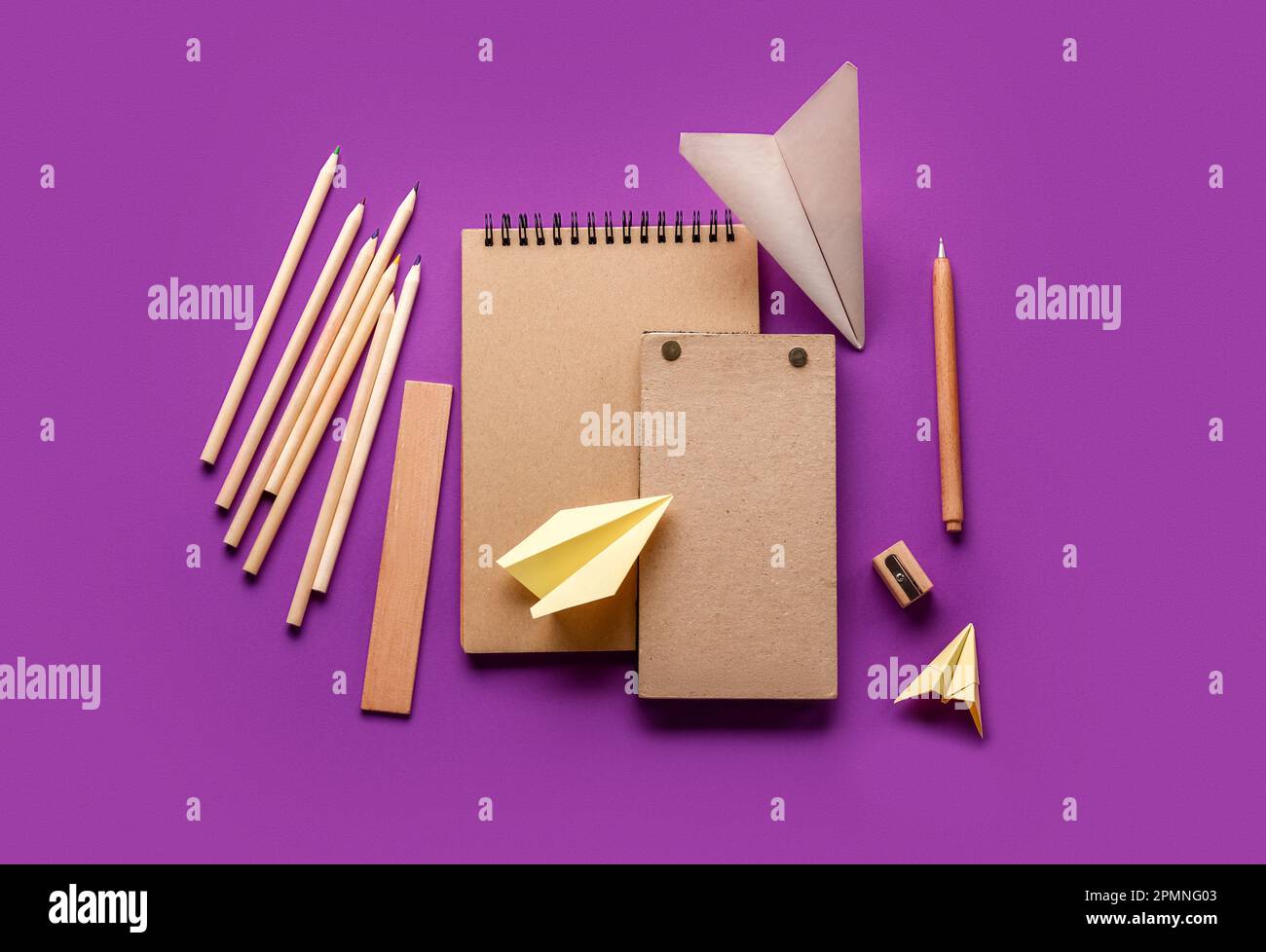 Composition with stationery supplies and paper planes on purple background Stock Photo Alamy