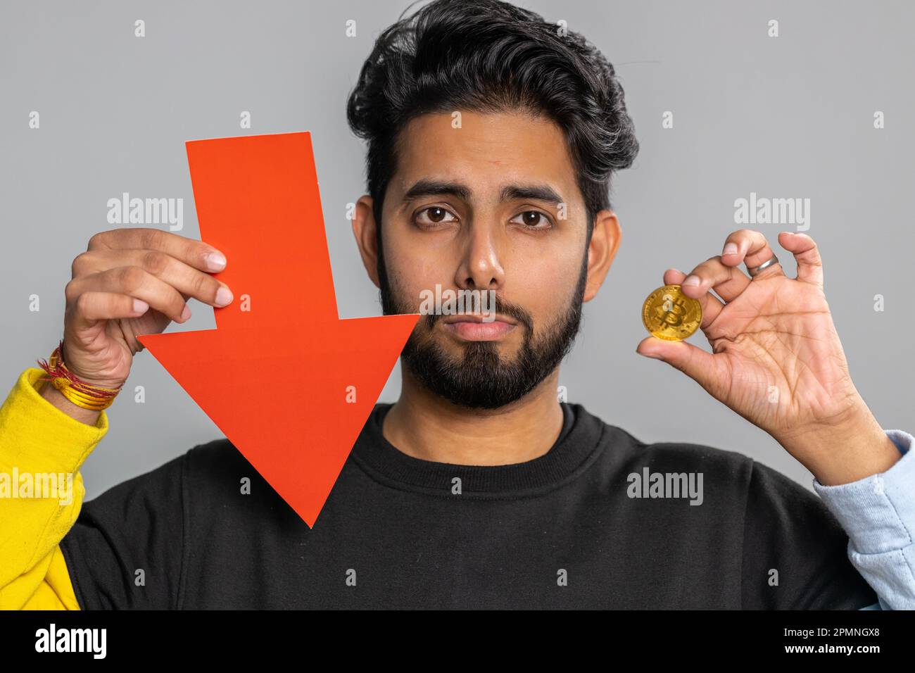 Upset indian man showing red arrow pointing down, downgrade, unsuccessful  business, fall of cryptocurrency stock market investment, mining bitcoins  BTC money exchange rate, bankruptcy fail. Hindu guy Stock Photo - Alamy