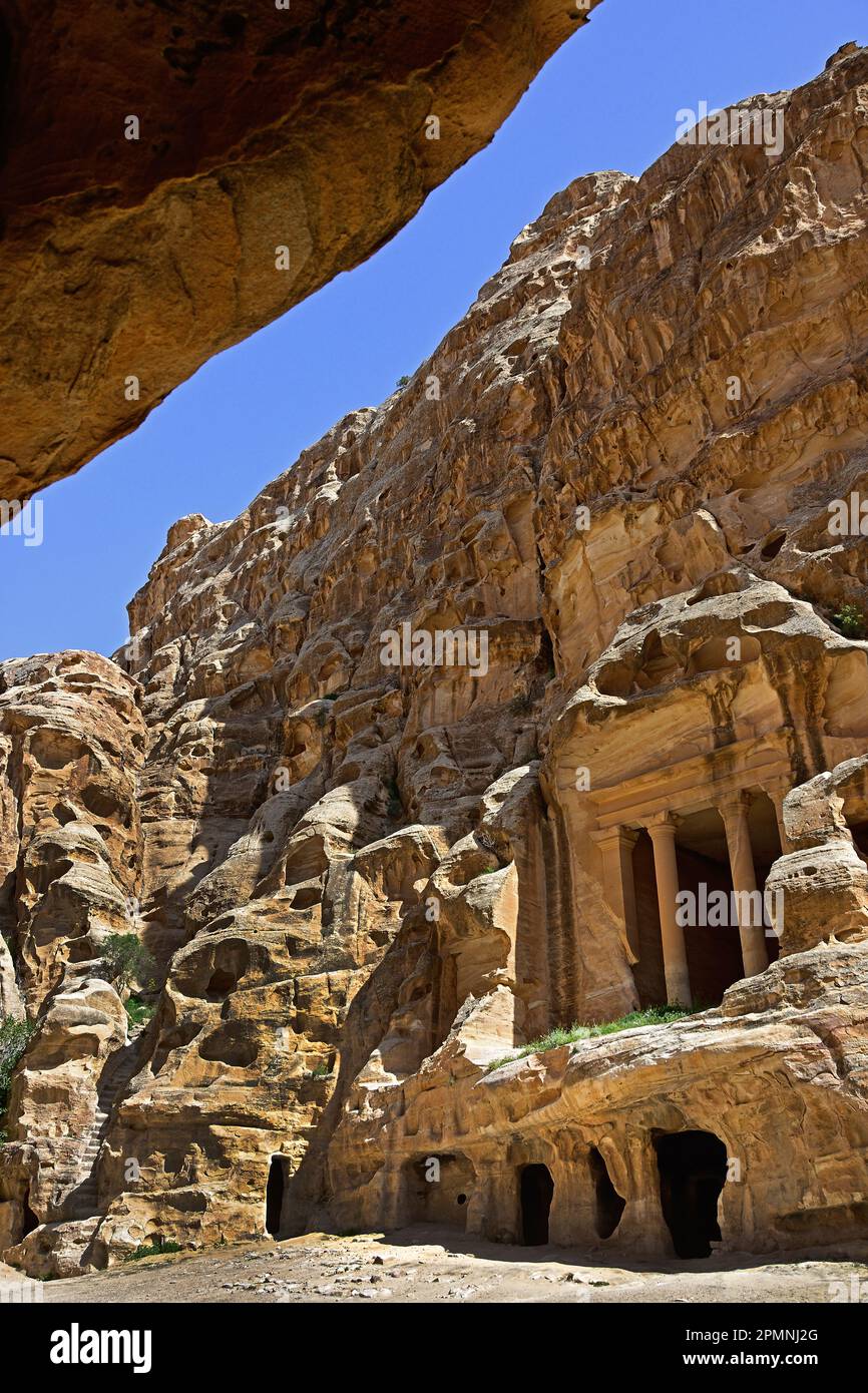 Petra city Nabataean caravan-city rock-cut façades Jordan carved sandstone rock desert. Stock Photo