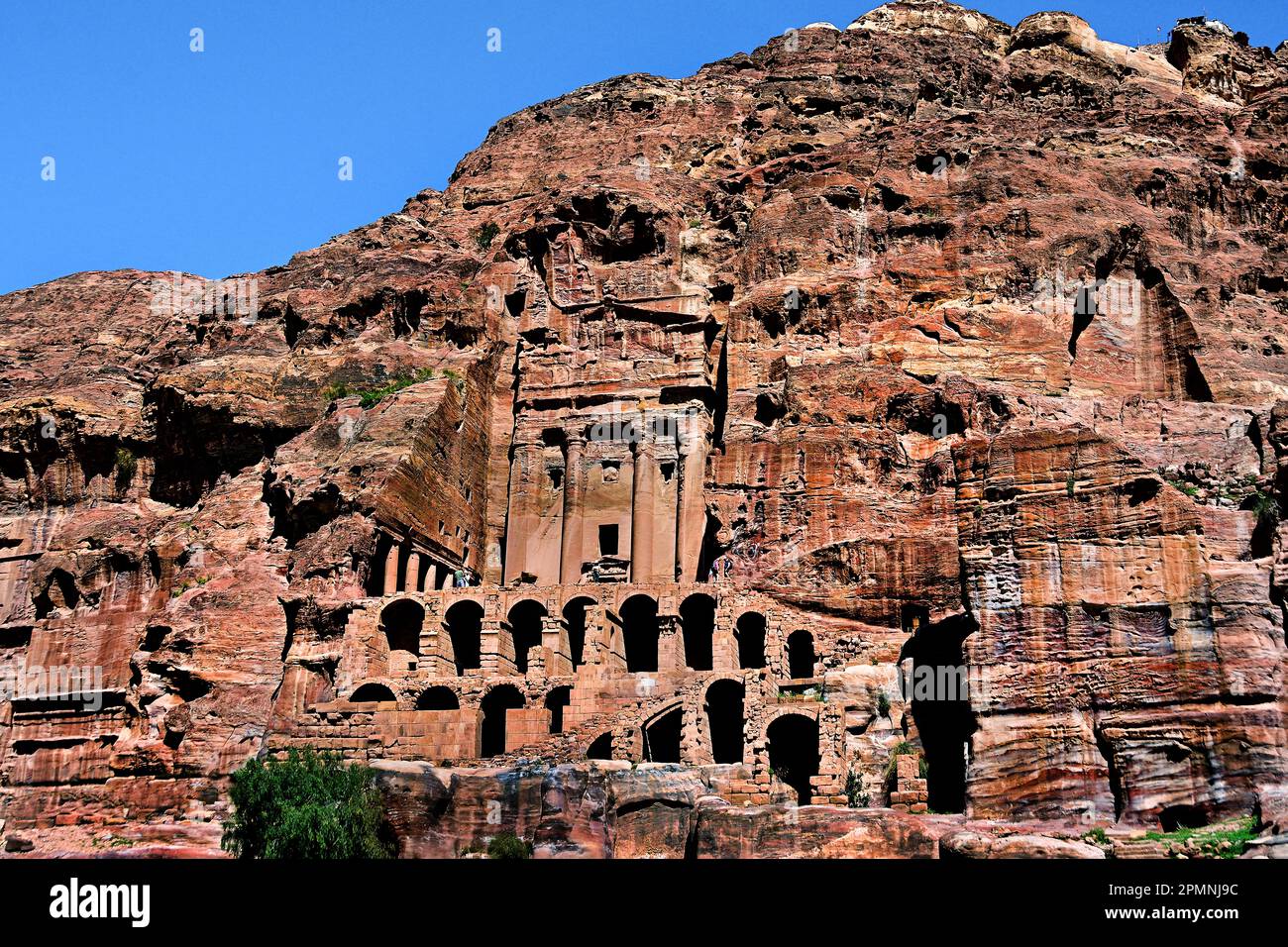 Urn Tomb (The Court),  Tomb Petra city Nabataean caravan-city rock-cut façades Jordan carved sandstone rock desert. Stock Photo