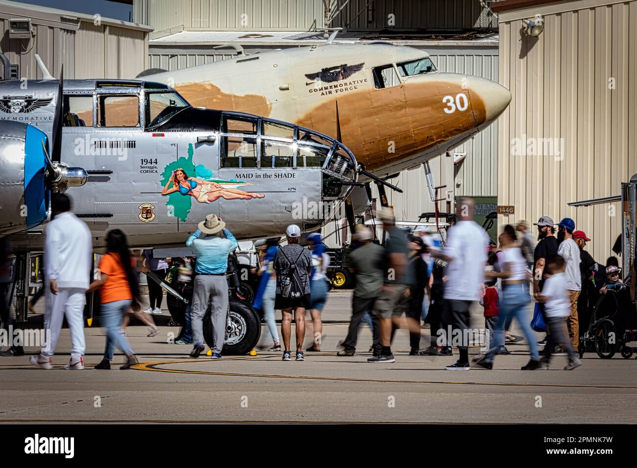 Crowds walk around a B-25 Mitchell bomber and a C-47 Skytrain at the 2023 Thunder and Lightning Over Arizona in Tucson, Arizona. Stock Photo