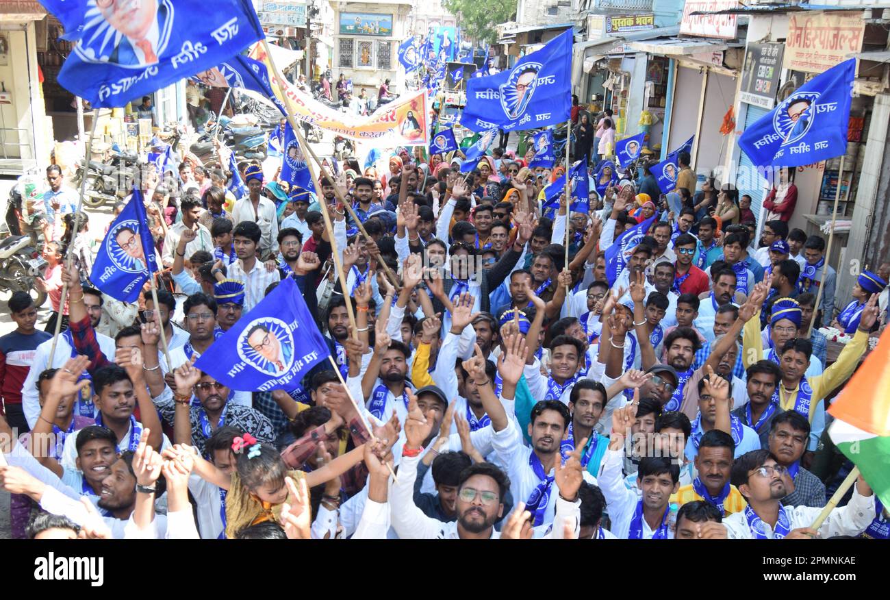 Beawar, Rajasthan, India, April 14, 2023: Members of Dalit community take part in a procession and holding flags of Babasaheb Bhimrao Ambedkar on his birth anniversary in Beawar. Ambedkar Jayanti is celebrated on April 14 to mark the birth anniversary of Dr. Bhimrao Ambedkar, who is also remembered as the 'Father of the Indian Constitution'. Ambedkar was an Indian jurist, economist, politician and social reformer who inspired the Dalit Buddhist Movement. Credit: Sumit Saraswat/Alamy Live News Stock Photo