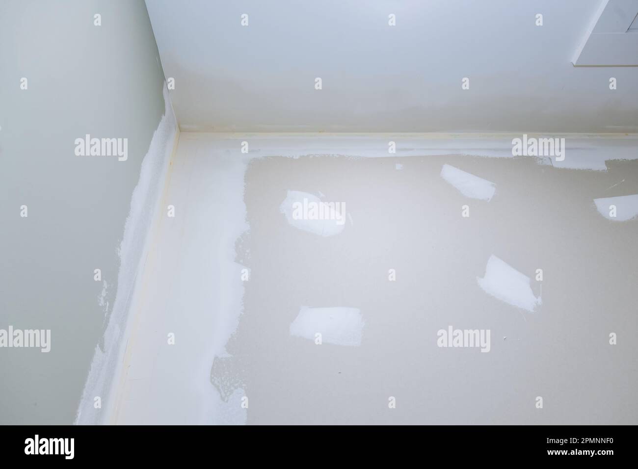 Newly constructed houses in process of being plastered with drywall are