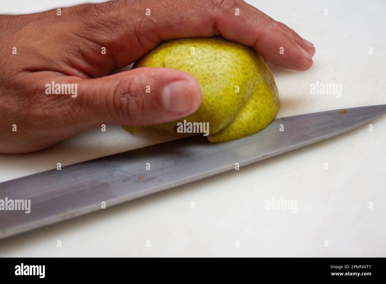 Slicing a pear hi-res stock photography and images - Alamy
