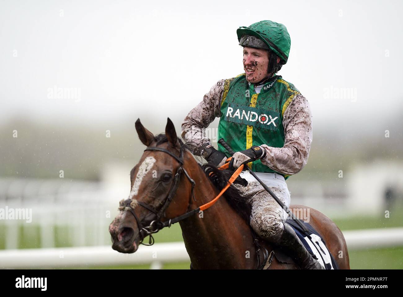 Jockey Ben Harvey covered in mud after the William Hill Handicap Hurdle on day two of the Randox Grand National Festival at Aintree Racecourse, Liverpool. Picture date: Friday April 14, 2023. Stock Photo