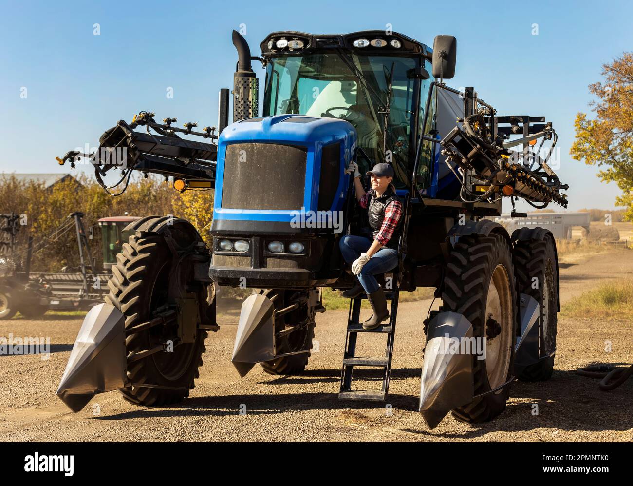 Farmer sitting on a tractor hi-res stock photography and images - Alamy