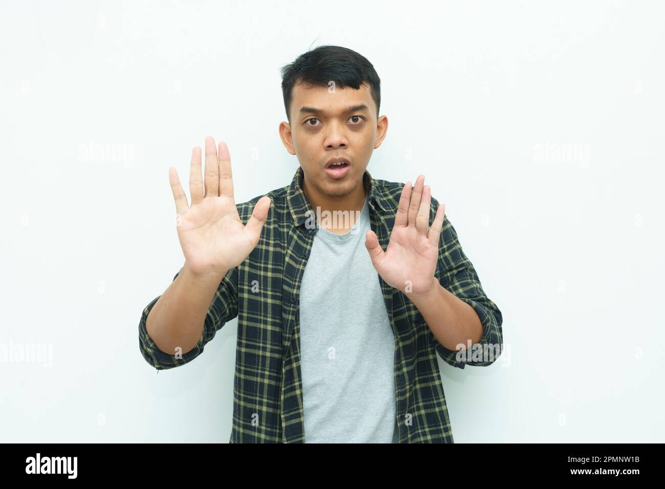 Young Asian man put hands in front of body for stop sign gesture Stock ...
