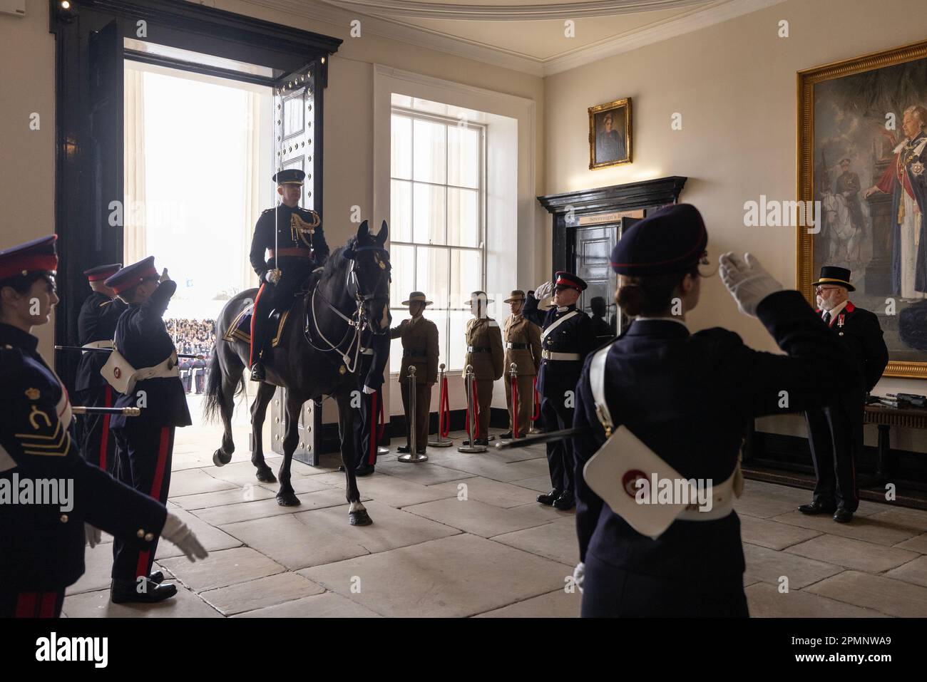 Major C Davies rides Faulkner through the main doors of the academy for