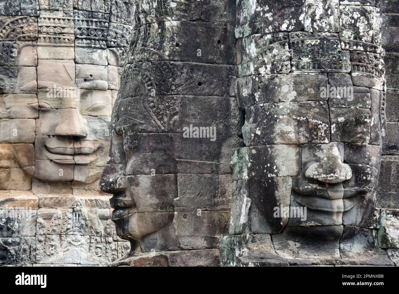 Stone faces on the towers of Angkor Thom; Siem Reap, Angkor, Cambodia Stock Photo