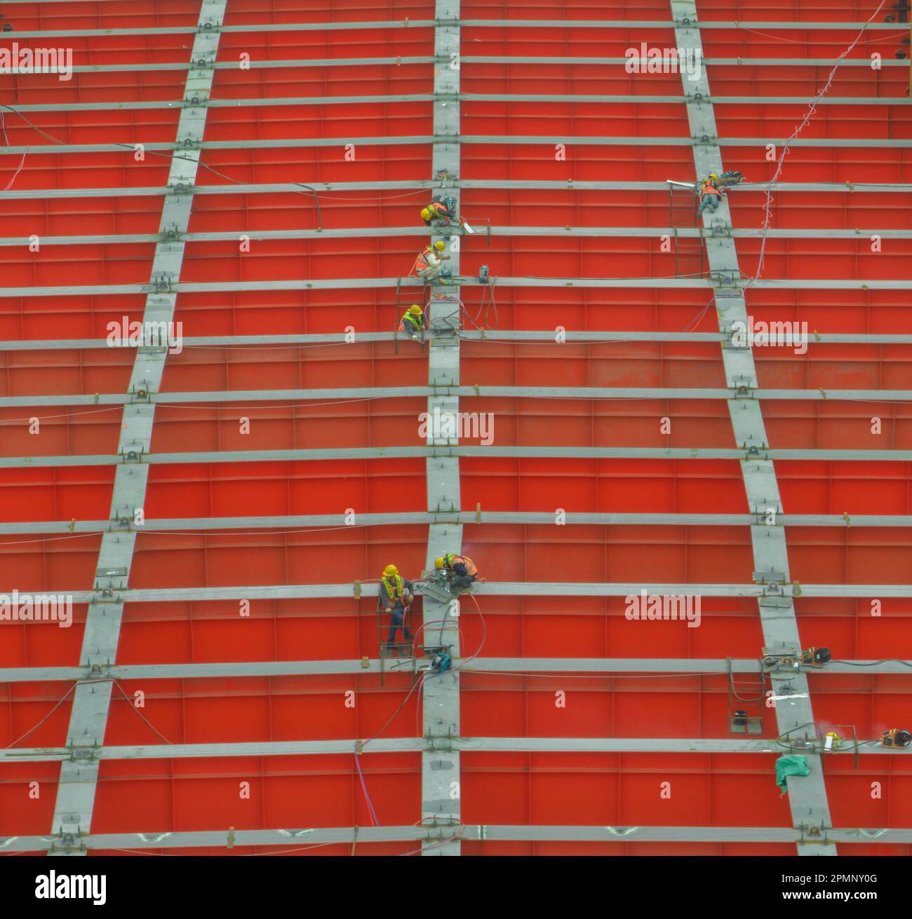 KUNSHAN, CHINA - APRIL 14, 2023 - Aerial photo shows workers at the construction of the Wusong River Bridge in Kunshan, Jiangsu province, China, April Stock Photo