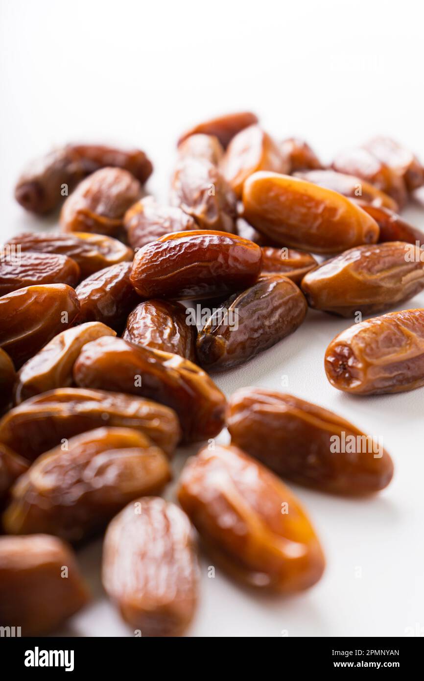 Fresh dried dates fruit on white isolated background. Stock Photo