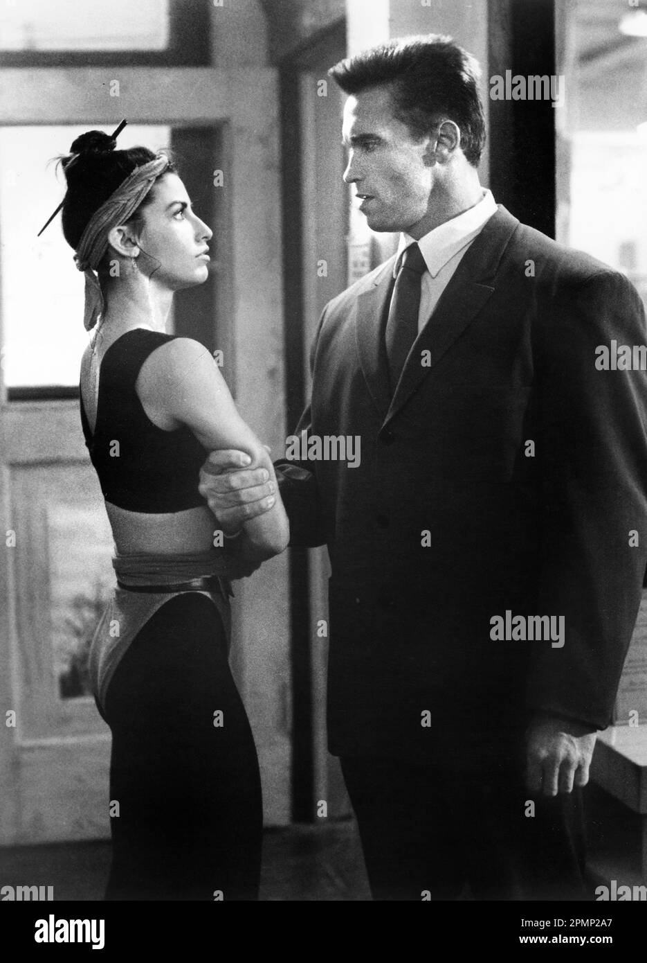 Gina Gershon, Arnold Schwarzenegger, on-set of the Film, 'Red Heat', TriStar Pictures, 1988 Stock Photo