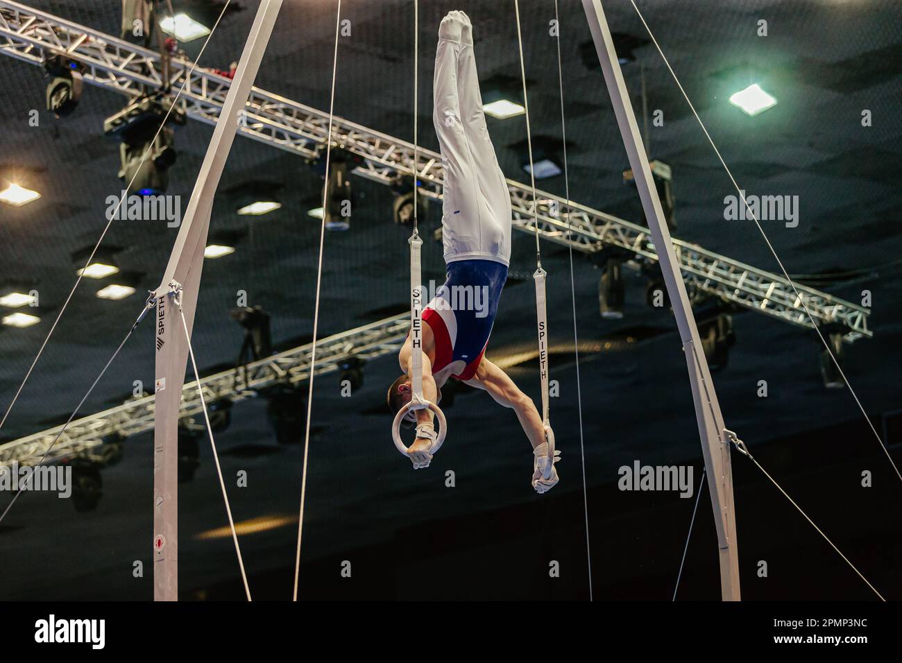 gymnast exercise on ring frame in gymnastics summer games, apparatus