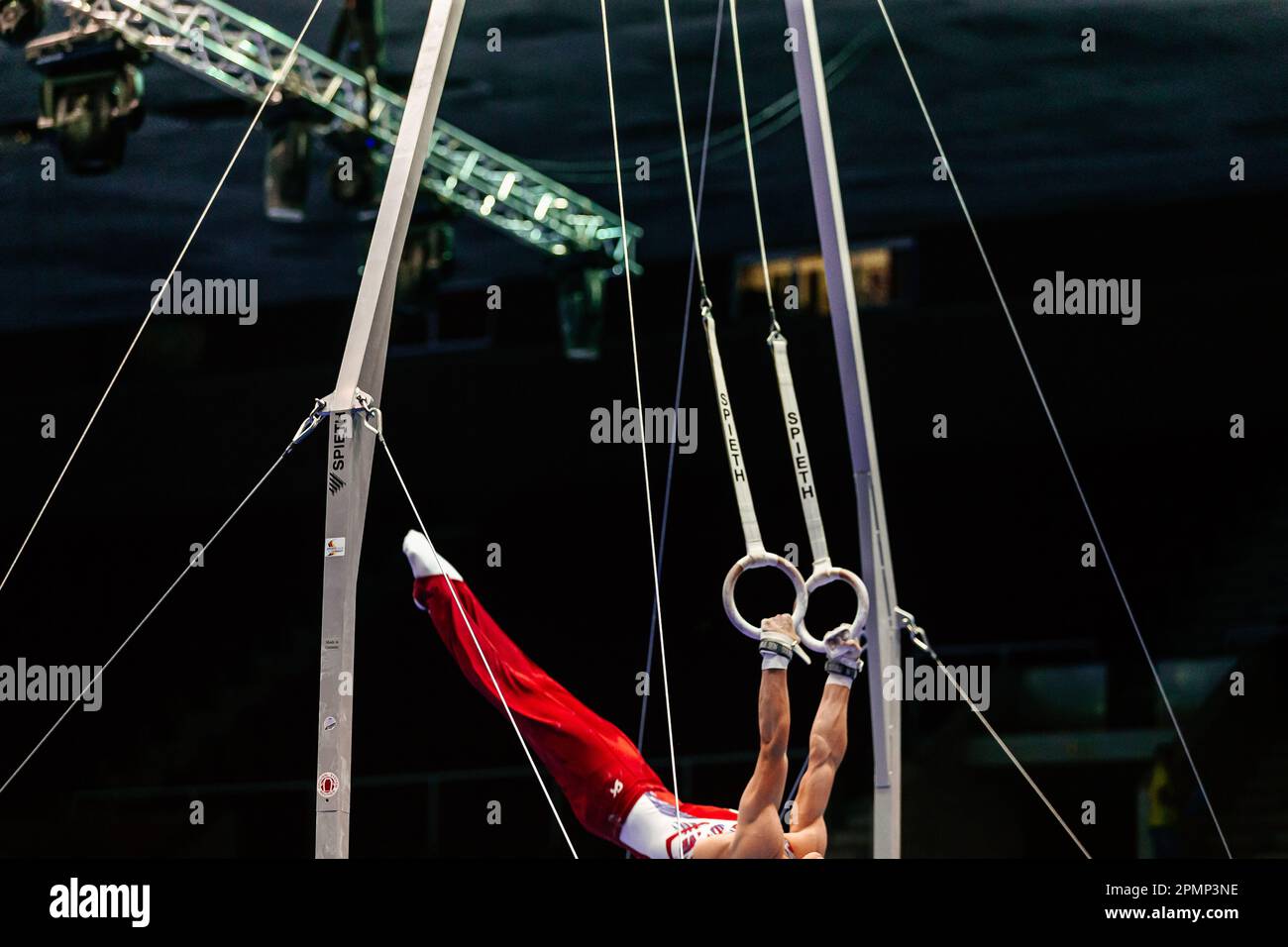 athlete gymnast exercise on ring frame in gymnastics summer games
