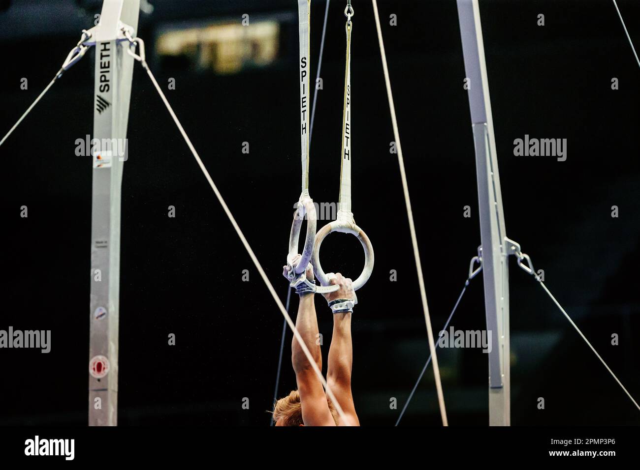 hand athlete gymnast exercise on ring frame in gymnastics. apparatus