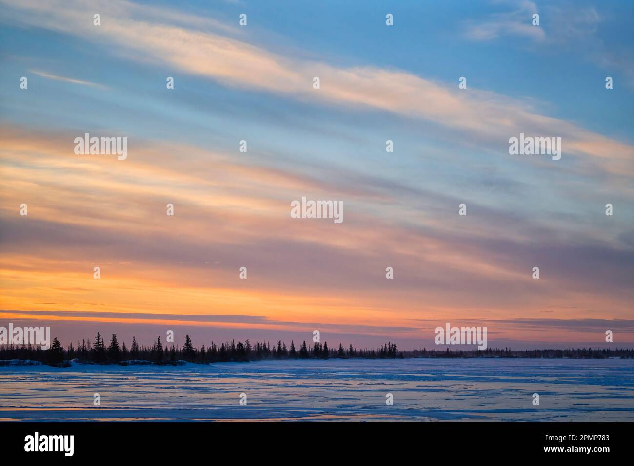 Sunrise over a frozen lake outside Churchill, Manitoba; Manitoba, Canada Stock Photo