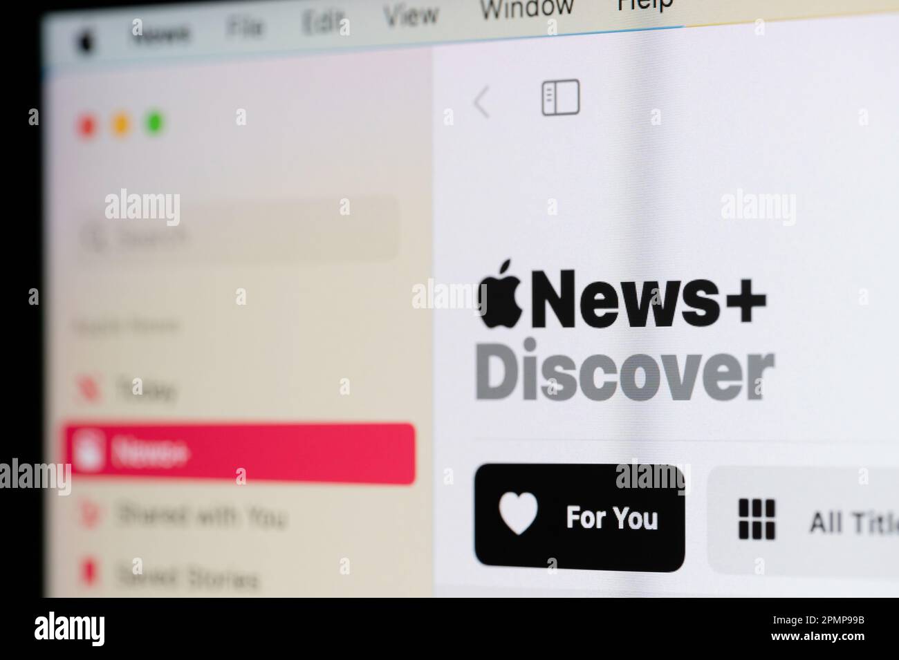 New york, USA - April 12, 2023: Discover apple news on computer screen close up view Stock Photo