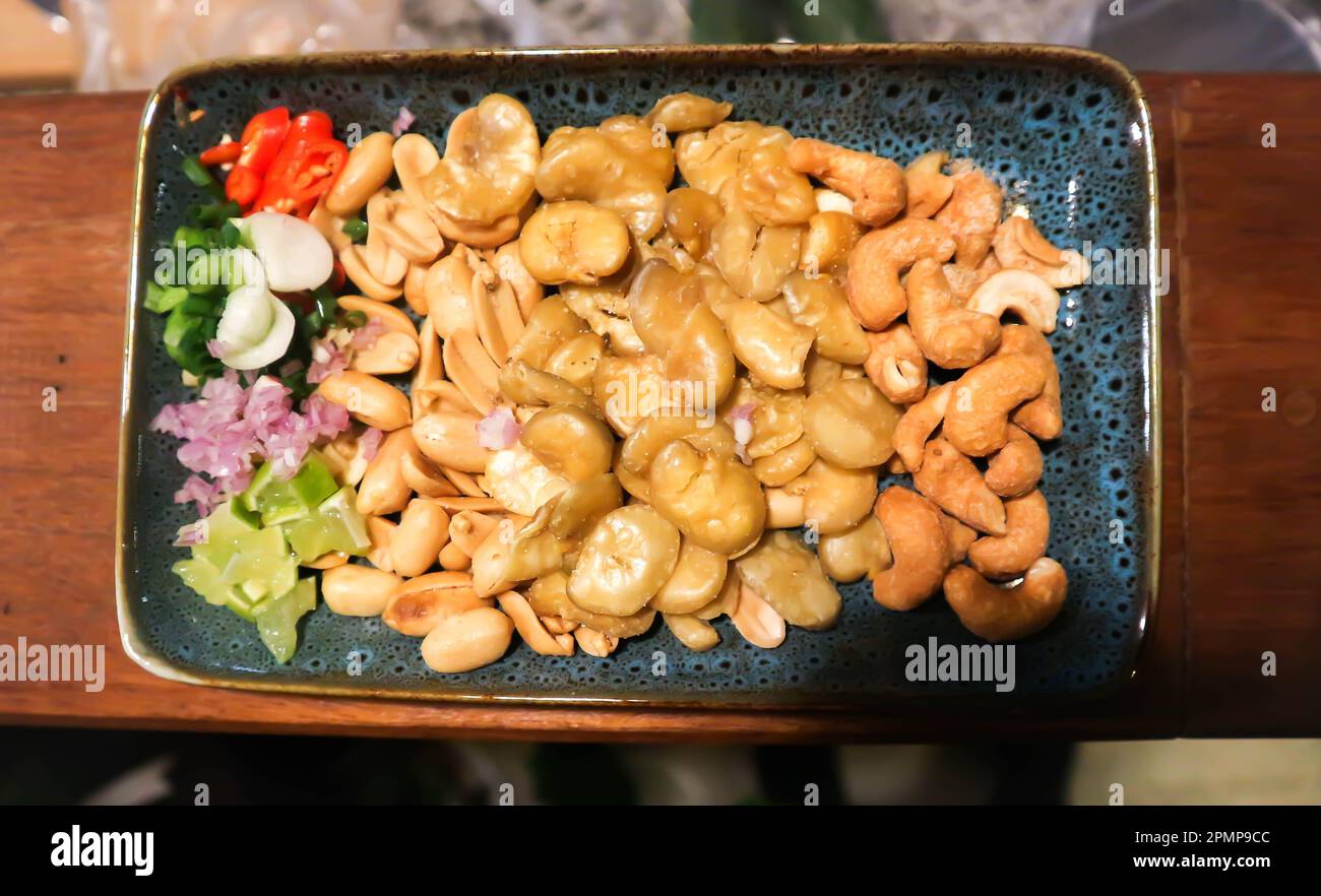 Broad bean , cashew nut and peanuts or fava beans with vegetable Stock