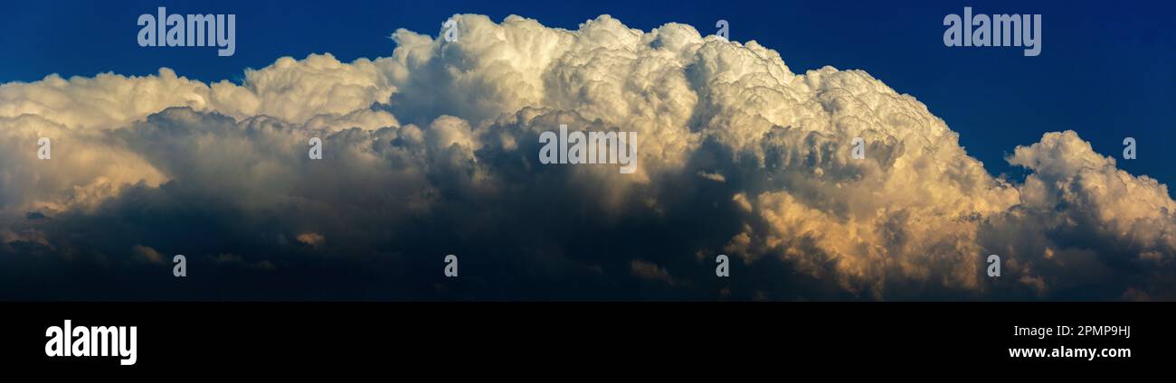 Panorama of dramatic storm clouds and blue sky above; Calgary, Alberta, Canada Stock Photo