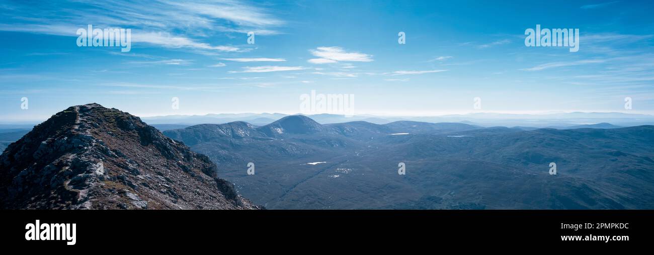 Vast mountainous landscape under a blue sky with cloud; Ireland Stock Photo