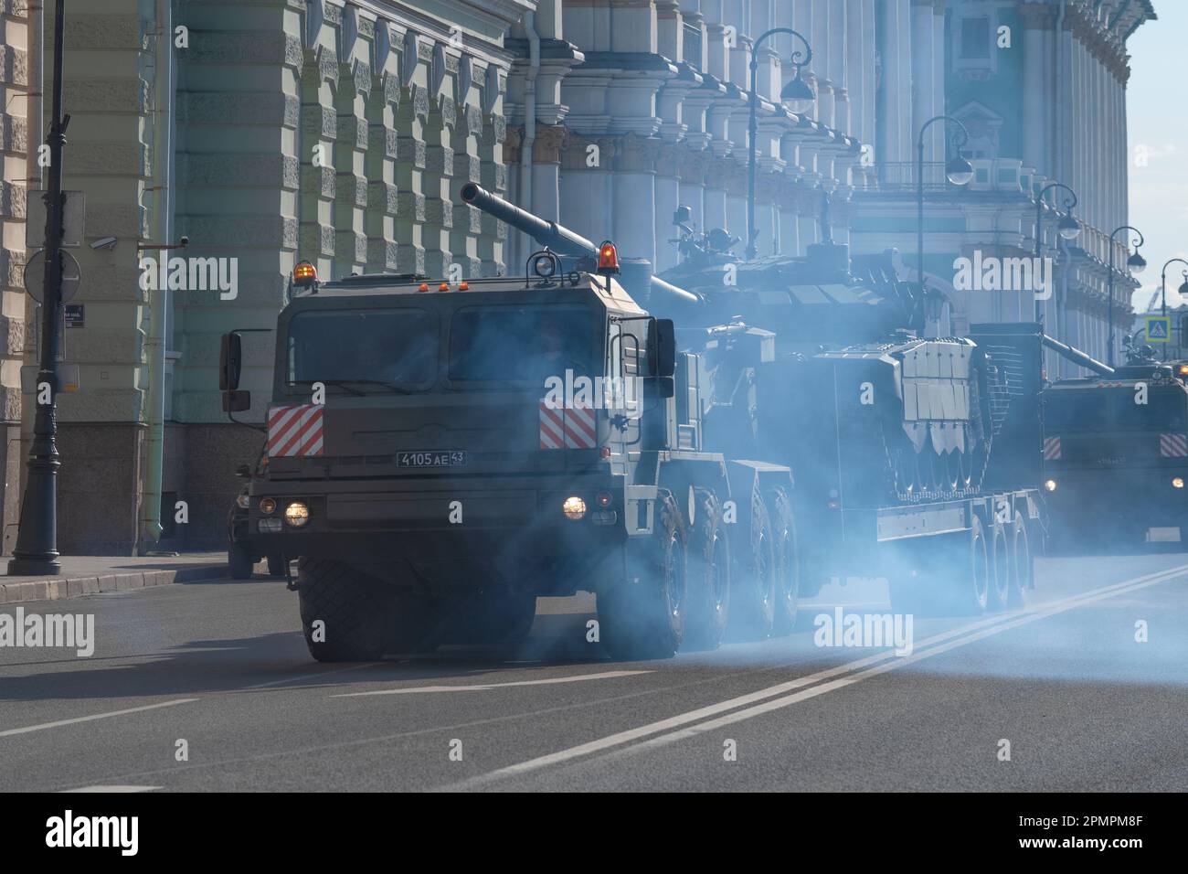 SAINT PETERSBURG, RUSSIA - APRIL 28, 2022: Heavy transporter of the BAZ-6403 transports a T-73B3 tank. Preparation for the military parade in honor of Stock Photo