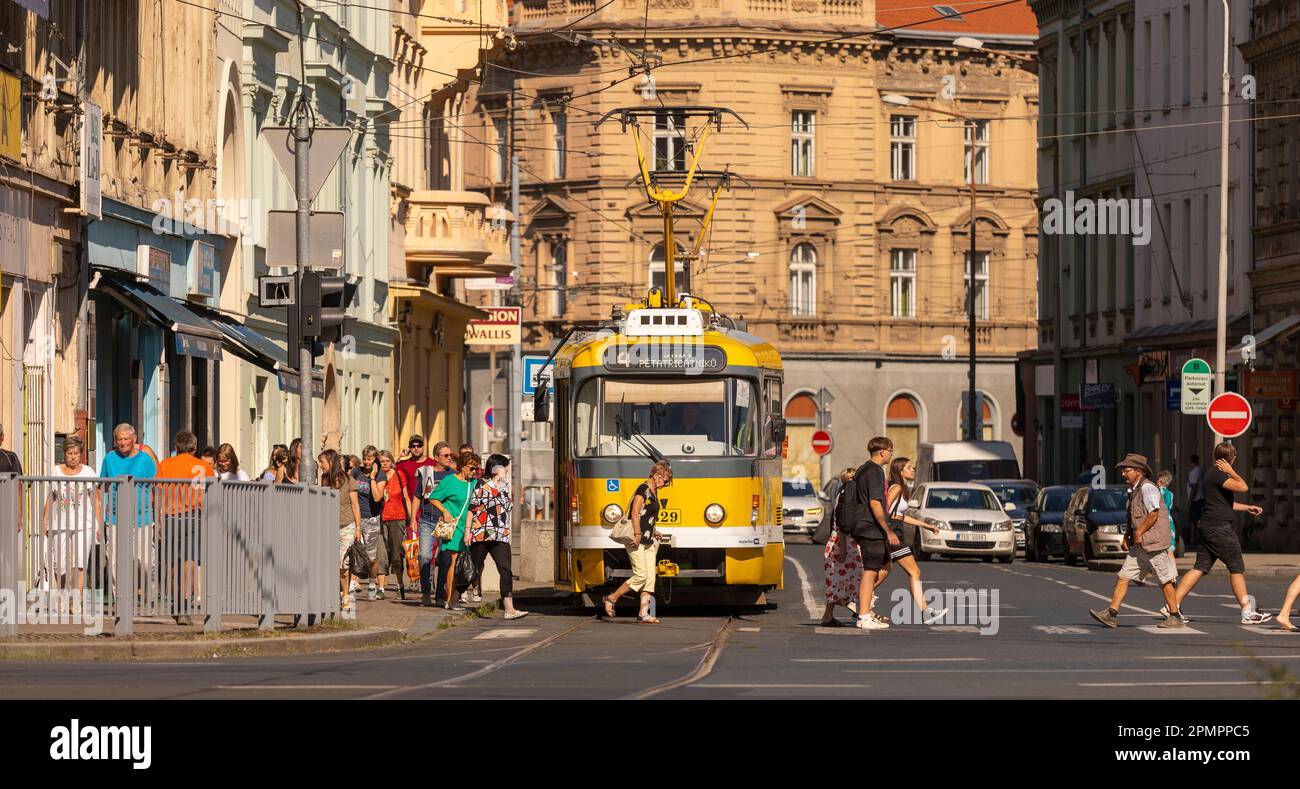 PILSEN, CZECH REPUBLIC, EUROPE - Tram streetcar and people crossing street, at Pilsen Main Square. Stock Photo