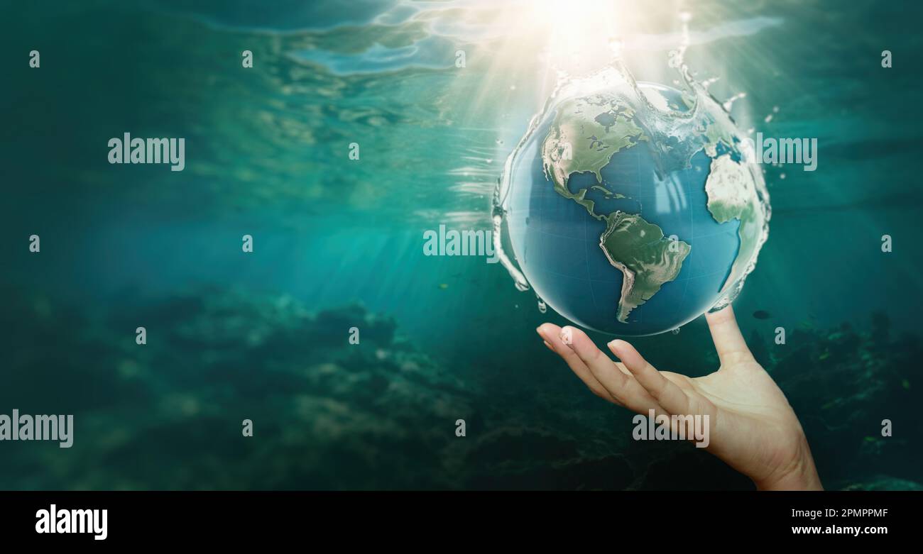 hand holding the planet earth underwater,Save water concept, world water day. Stock Photo