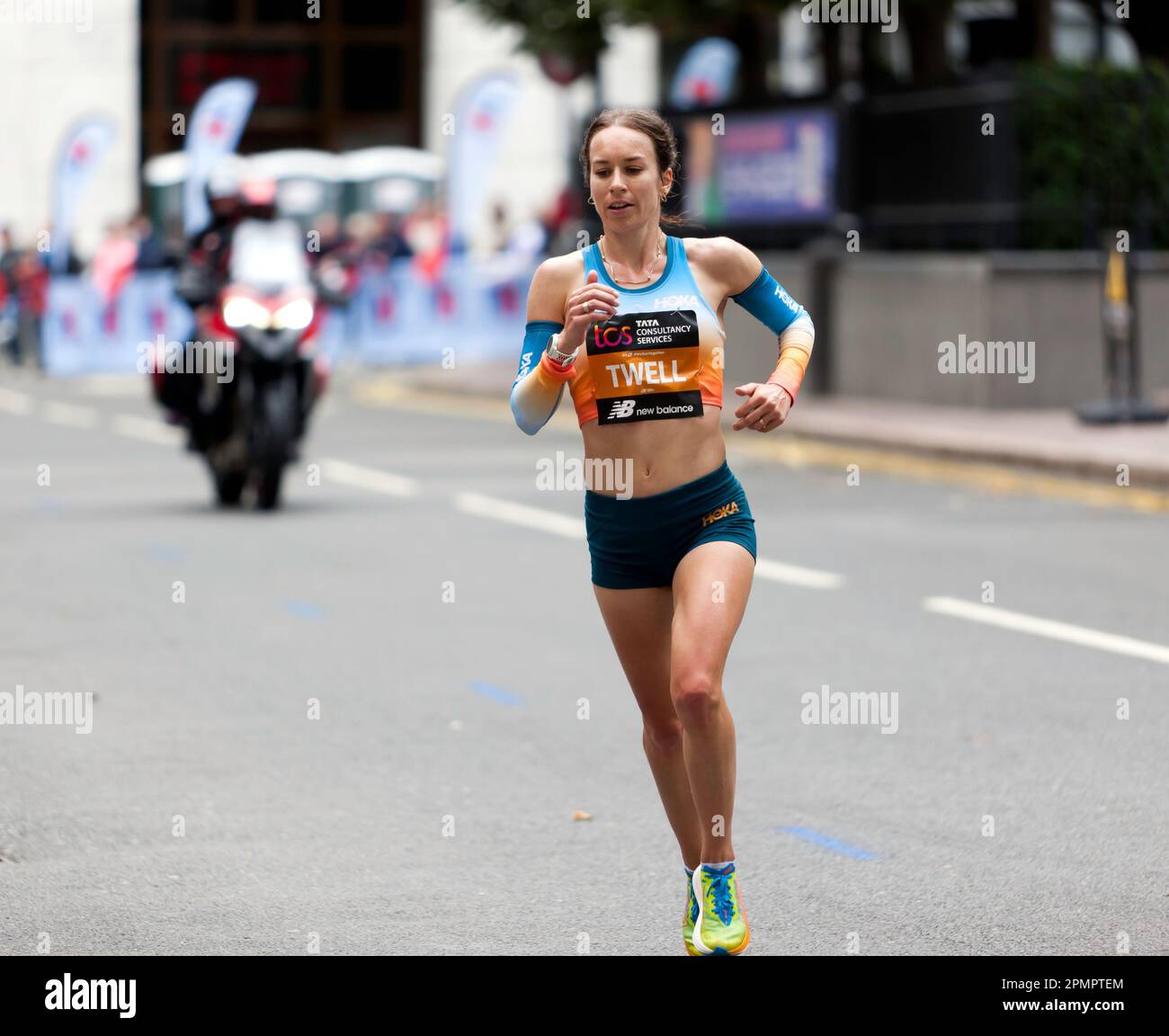 Stephanie Twell, passing through Cabot Square, on her way to finish 12th in the Women's Elite Race, during the 2022 London Marathon. Stock Photo