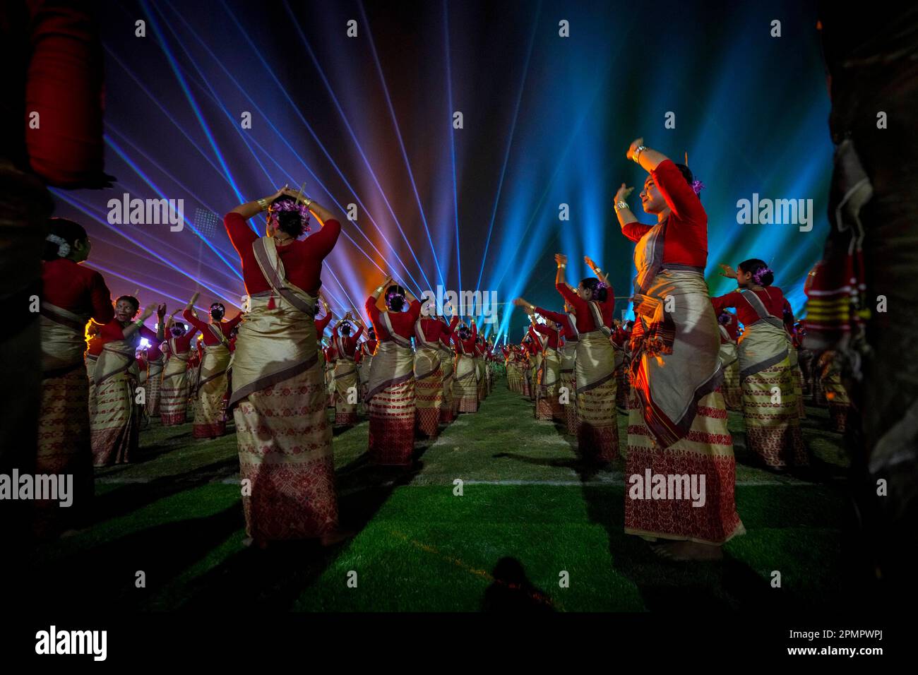 Assamese dancers in traditional attire perform as they attempt Guinness