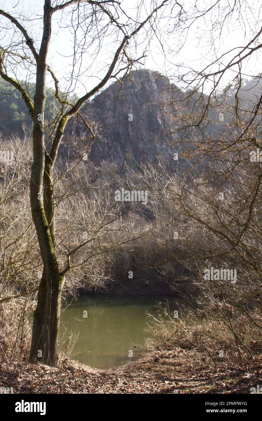 Rotenfels behind the Nahe River on a sunny winter day in Bad Kreuznach, Germany. Stock Photo