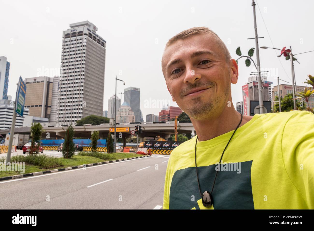  Tourist traveler takes photos Selfie with the city cityscape buildings ...