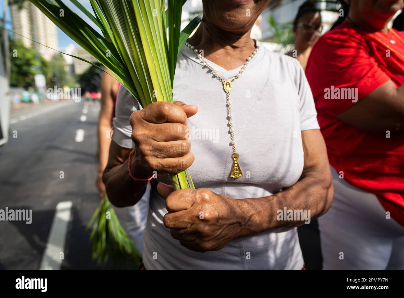 Salvador, Bahia, Brazil Abril 02, 2023 Catholic worshipers hold palm