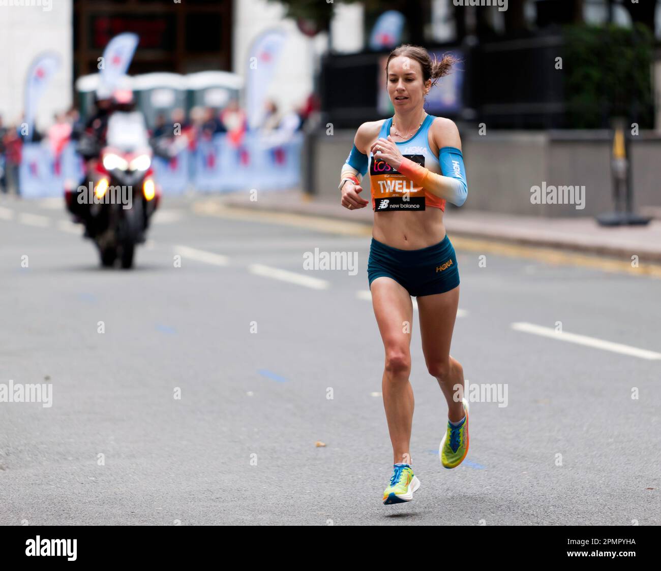 Stephanie Twell, passing through Cabot Square, on her way to finish 12th in the Women's Elite Race, during the 2022 London Marathon. Stock Photo