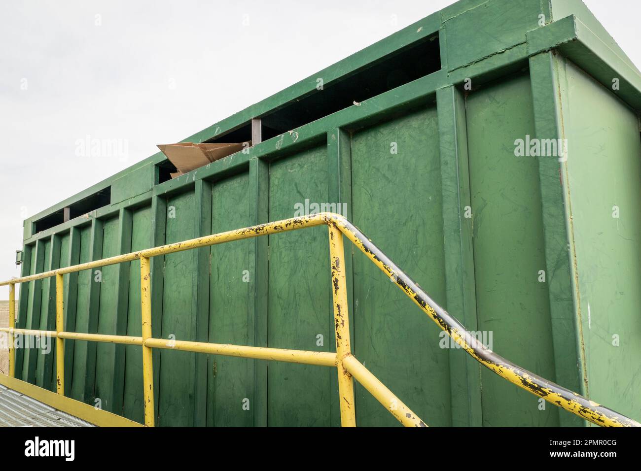 green steel container for recycling cardboard at recycling center