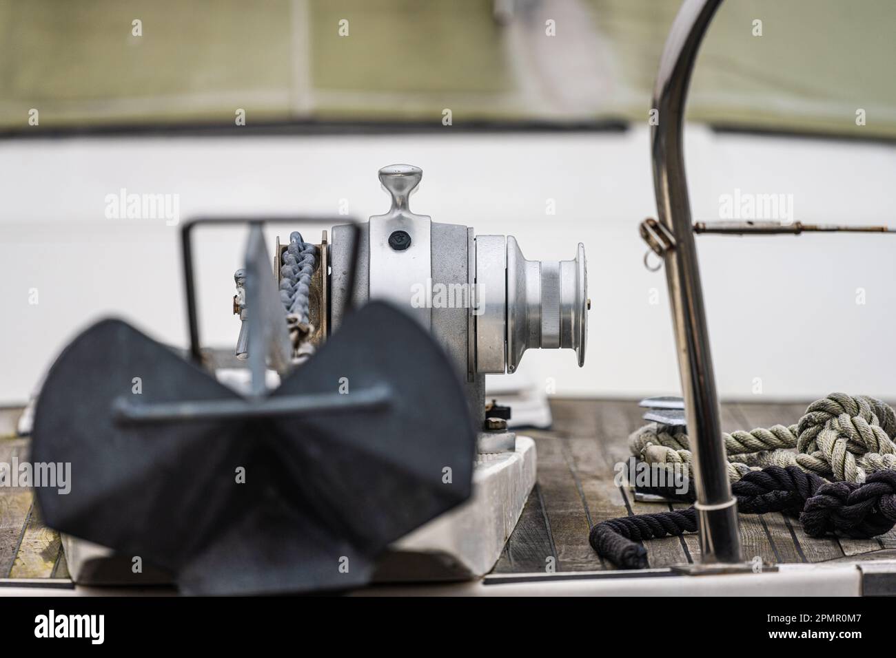 Anchor winch mounted on the bow of a boat Stock Photo - Alamy