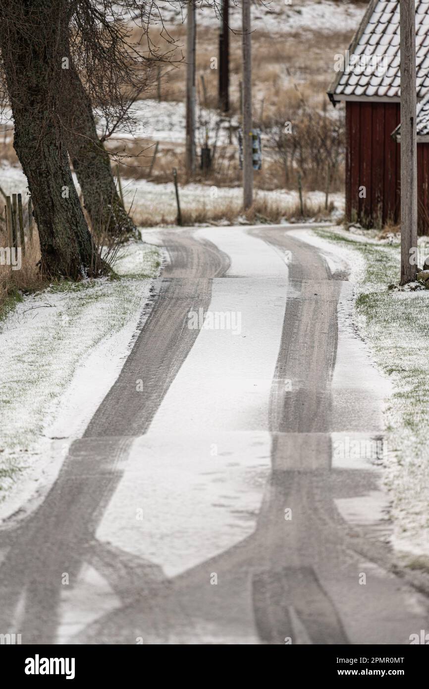 Tyre tracks on an icy road Stock Photo - Alamy