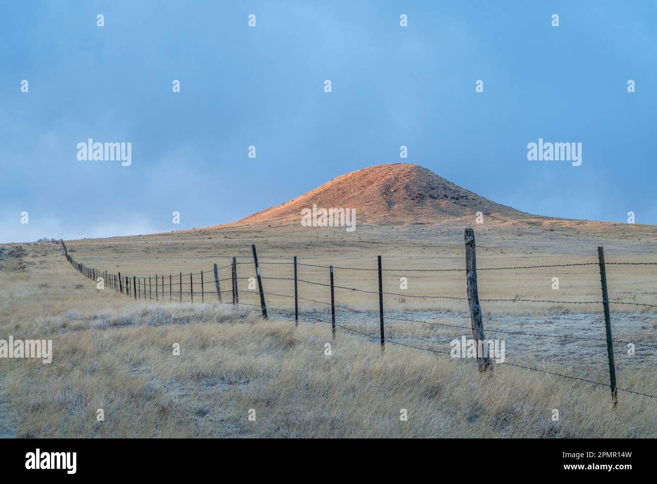 Cattle fence in Colorado prairie at sunset - Soapstone Prairie Natural Area near Fort Collins Stock Photo