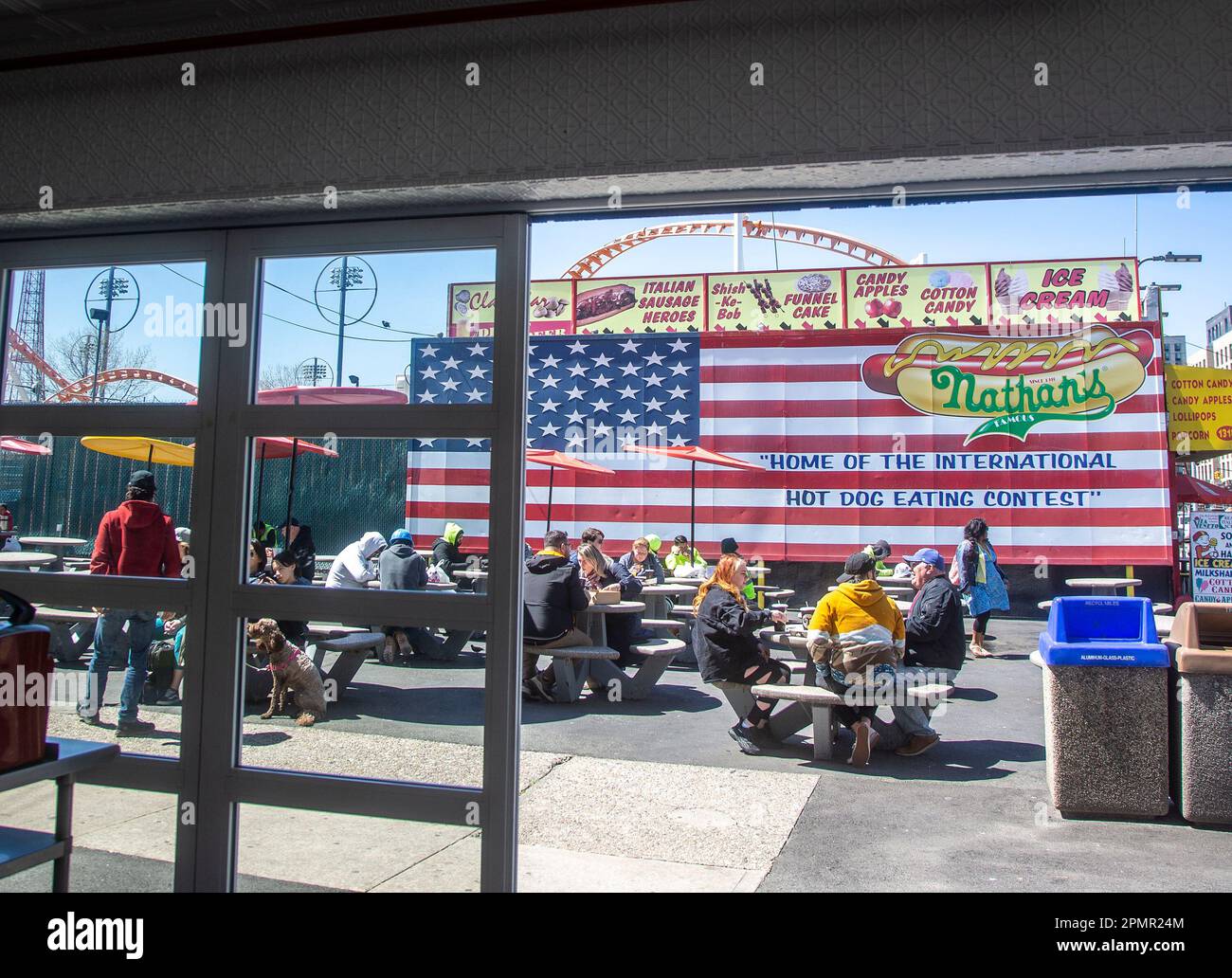 People eating at Nathan's in Coney Island, NY Stock Photo