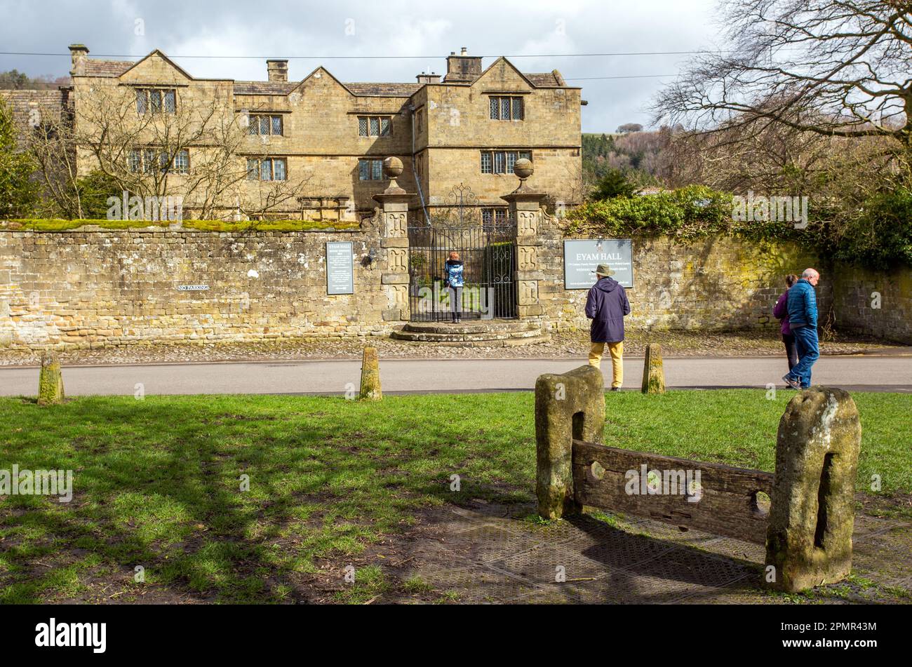 Eyam Hall, a Jacobean style manor house in the Derbyshire Peak District plague village of Eyam England seen from the stocks on the village green Stock Photo