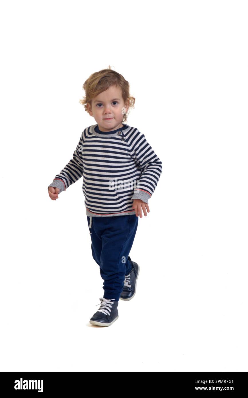 front view of a baby boy walking on white background Stock Photo Alamy
