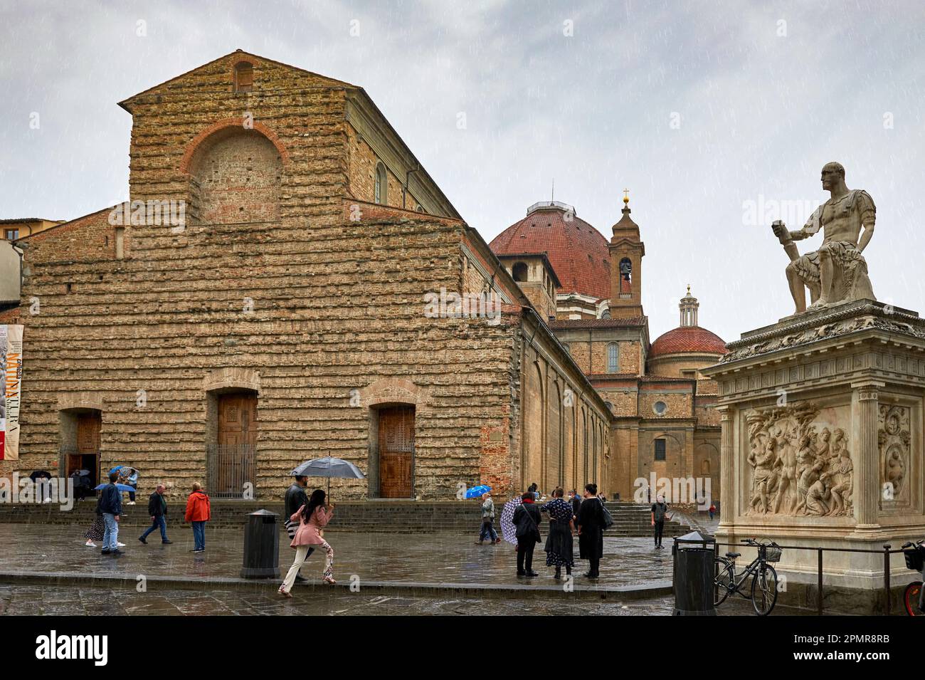 View on San Lorenzo church and Lodovico de' Medici monument on a rainy day Stock Photo