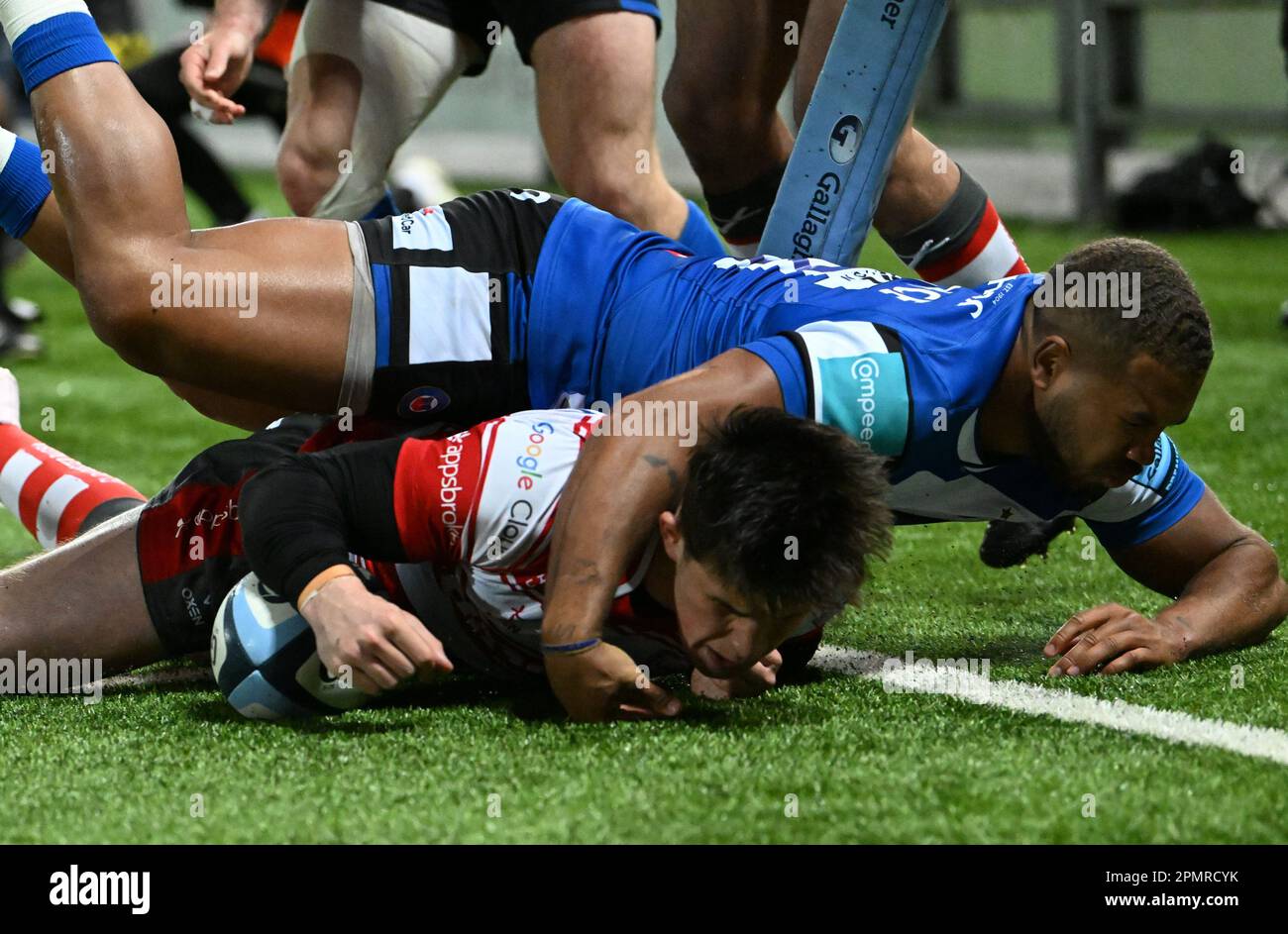 Kingsholm Stadium, Gloucester, Gloucestershire, UK. 14th Apr, 2023. Gallagher Premiership Rugby, Gloucester versus Bath; Seb Atkinson of Gloucester scores a try under pressure from Ollie Lawrence of Bath in 45th minute bringing the score to 22-14 Credit: Action Plus Sports/Alamy Live News Stock Photo