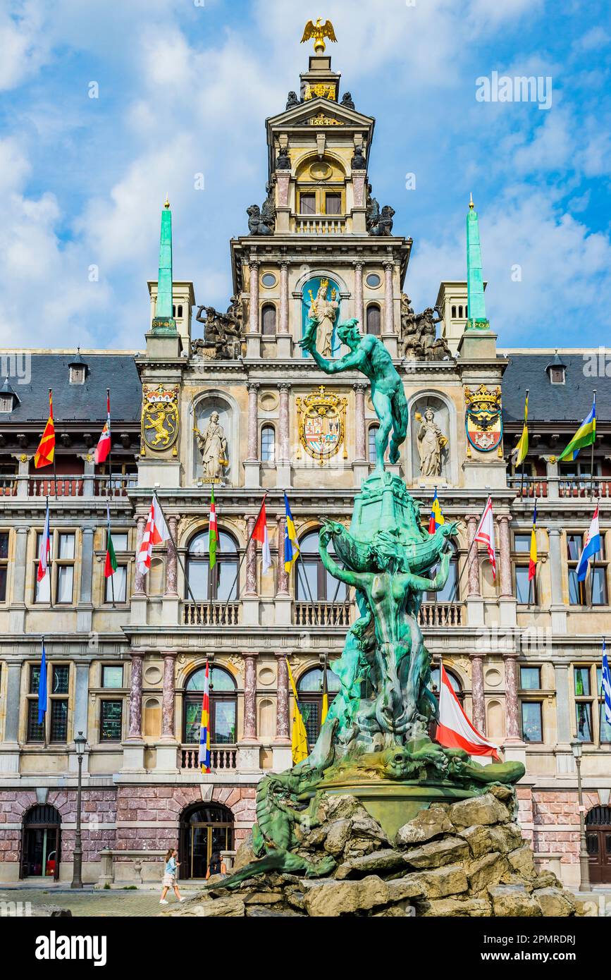 In the foreground, Silvius Brabo, a mythical Roman soldier who was said to have killed a giant, Druon Antigoon, and the City Hall of Antwerp, Renaissa Stock Photo