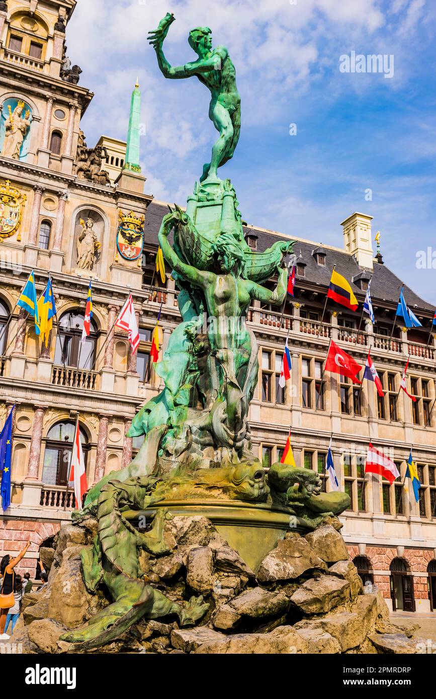 In the foreground, Silvius Brabo, a mythical Roman soldier who was said to have killed a giant, Druon Antigoon, and the City Hall of Antwerp, Renaissa Stock Photo