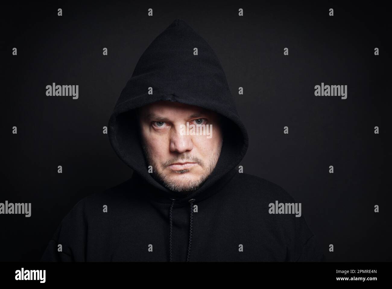 man wearing black hoodie hooligan or gangster concept Stock Photo Alamy